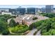 Aerial view showcasing apartments nestled among trees, featuring modern architecture and scenic surroundings at 10 Perimeter Summit Ne Br # 2312, Atlanta, GA 30319