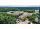 Aerial of a community with mature trees, multi-story buildings, and parking at 10 Perimeter Summit Ne Br # 2312, Atlanta, GA 30319