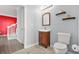 Cozy bathroom features a wooden vanity, tile floor, and decorative shelves at 10 Perimeter Summit Ne Br # 2312, Atlanta, GA 30319
