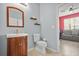 Bathroom featuring a modern vanity, decorative shelves and tan ceramic tile flooring at 10 Perimeter Summit Ne Br # 2312, Atlanta, GA 30319