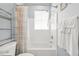 Bright bathroom with a shower and tub combo, complemented by white fixtures and a modern design at 10 Perimeter Summit Ne Br # 2312, Atlanta, GA 30319