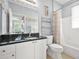 Bathroom featuring a combination tub and shower with neutral accents and modern fixtures at 10 Perimeter Summit Ne Br # 2312, Atlanta, GA 30319