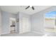 Comfortable bedroom with a ceiling fan, soft carpet, and an en-suite bathroom at 10 Perimeter Summit Ne Br # 2312, Atlanta, GA 30319