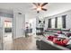Bright living room featuring a fireplace, gray sectional sofa, and modern decor at 10 Perimeter Summit Ne Br # 2312, Atlanta, GA 30319
