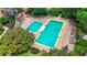 Aerial view of the luxurious community pool with lounge chairs and meticulous landscaping at 10 Perimeter Summit Ne Br # 2312, Atlanta, GA 30319
