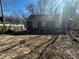 Features a cozy backyard with a well-maintained exterior and lush greenery at 1457 Richland Road Southwest Sw Rd, Atlanta, GA 30310