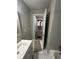 Neutral bathroom with tile floors, a vanity with chrome fixtures, and tile accents at 1457 Richland Road Southwest Sw Rd, Atlanta, GA 30310