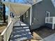 Side view of home featuring a covered porch providing shade and comfortable outdoor living space at 1457 Richland Road Southwest Sw Rd, Atlanta, GA 30310