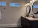 Bright bathroom with double vanity sinks and natural light from windows at 1647 Walker Ave, Atlanta, GA 30337