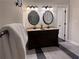 Bathroom features a dual vanity with dark wood cabinets and attractive lighting at 1647 Walker Ave, Atlanta, GA 30337
