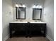 Bathroom features a double vanity with dark wood cabinets and attractive lighting at 1647 Walker Ave, Atlanta, GA 30337
