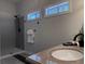 Bathroom with a shower, dual vanity with sink, and modern lighting at 1647 Walker Ave, Atlanta, GA 30337