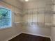 Walk-in closet with a window and adjustable shelving units at 1647 Walker Ave, Atlanta, GA 30337