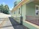Side view of the exterior with a fenced driveway and porch at 1647 Walker Ave, Atlanta, GA 30337