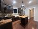 Modern kitchen featuring dark cabinets, stainless steel appliances, and a center island at 1647 Walker Ave, Atlanta, GA 30337