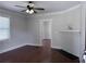 Bright living room with hardwood floors, white trim, and a decorative fireplace at 1647 Walker Ave, Atlanta, GA 30337