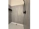 Modern shower with gray tiling and a sleek, black showerhead at 1647 Walker Ave, Atlanta, GA 30337