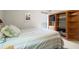 Cozy bedroom features built-in shelves, window, and a comfortable bed with striped bedding at 620 Granville Ct, Sandy Springs, GA 30328