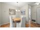 The dining area features light wood floor, neutral walls, and modern chandelier at 620 Granville Ct, Sandy Springs, GA 30328