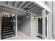 The exterior entrance to unit 620 with painted gray wood paneling and black trim at 620 Granville Ct, Sandy Springs, GA 30328