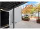 Welcoming front entrance featuring well-lit doorway, grey siding, and a small garden area at 620 Granville Ct, Sandy Springs, GA 30328