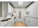 Modern kitchen with white cabinetry, stainless steel appliances, and plenty of counter space for cooking at 620 Granville Ct, Sandy Springs, GA 30328