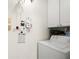 Practical laundry room featuring a washing machine, storage cabinets, and utility supplies for convenience at 620 Granville Ct, Sandy Springs, GA 30328