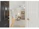 View from entryway into living room with neutral paint and light-colored furnishings at 620 Granville Ct, Sandy Springs, GA 30328