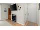 Living room with fireplace, flat screen television, and light wood flooring at 620 Granville Ct, Sandy Springs, GA 30328