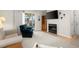 Spacious living room with fireplace, television, access to back porch, and light-colored walls at 620 Granville Ct, Sandy Springs, GA 30328