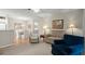 Spacious living room has neutral walls, carpeted floor, and direct access to dining area at 620 Granville Ct, Sandy Springs, GA 30328