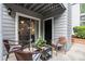Relaxing patio area with wicker furniture and view of the yard at 620 Granville Ct, Sandy Springs, GA 30328