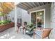 Outdoor patio with cozy wicker seating and peaceful community landscape views at 620 Granville Ct, Sandy Springs, GA 30328