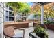 Inviting patio area with seating, brick accents, and landscape views at 620 Granville Ct, Sandy Springs, GA 30328