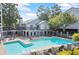 Resort-style pool featuring a sun deck and a lounge area perfect for relaxing in the summer sun at 620 Granville Ct, Sandy Springs, GA 30328