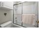 Shower over tub with sliding glass doors, white tile, and chrome fixtures at 620 Granville Ct, Sandy Springs, GA 30328