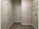 Laundry room featuring tile floors, storage shelves, and washer-dryer hookups at 3908 Shelleydale Dr # 39, Powder Springs, GA 30127