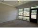 View from screened in porch overlooking backyard through grid windows and door at 3908 Shelleydale Dr # 39, Powder Springs, GA 30127