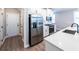 Well-equipped kitchen featuring stainless steel appliances, white cabinets, and ample counter space for meal preparation at 3739 Silvery Way, Powder Springs, GA 30127