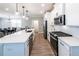 Modern kitchen with white cabinets, stainless steel appliances, and spacious island at 3739 Silvery Way, Powder Springs, GA 30127