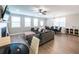 Spacious open-concept living room and dining room with hardwood floors and modern decor at 3739 Silvery Way, Powder Springs, GA 30127