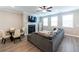 Inviting living room featuring a fireplace, a comfortable sectional sofa, and plenty of natural light from large windows at 3739 Silvery Way, Powder Springs, GA 30127