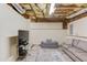Finished basement featuring modern decor, including a gray couch at 658 Eight Point Ct, Suwanee, GA 30024