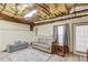 Relaxing finished basement with cozy furniture and exposed ceiling at 658 Eight Point Ct, Suwanee, GA 30024