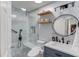 Bathroom featuring a glass enclosed shower with tile surround, a vanity and framed mirror at 658 Eight Point Ct, Suwanee, GA 30024