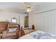 Bedroom featuring a chair, built-in shelves, and double closet at 658 Eight Point Ct, Suwanee, GA 30024