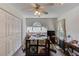 Bedroom featuring a large window, light colored walls and wood floor at 658 Eight Point Ct, Suwanee, GA 30024