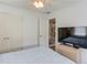 Bedroom with a large closet and view into the hall and upstairs at 658 Eight Point Ct, Suwanee, GA 30024