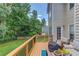 Spacious deck with outdoor seating area overlooking a serene backyard at 658 Eight Point Ct, Suwanee, GA 30024