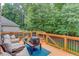 Enjoy the outdoors on this deck with seating and a wooded view at 658 Eight Point Ct, Suwanee, GA 30024